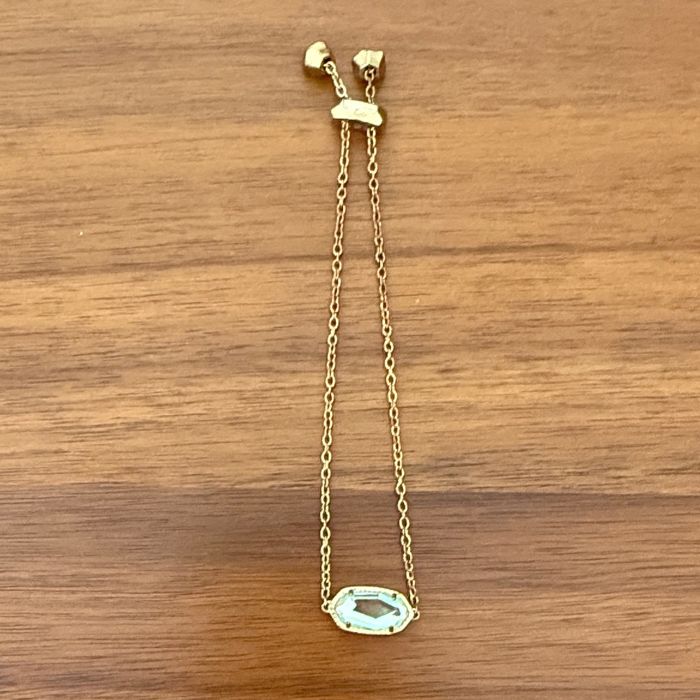 Kendra Scott “Elaina” gold adjustable bracelet.